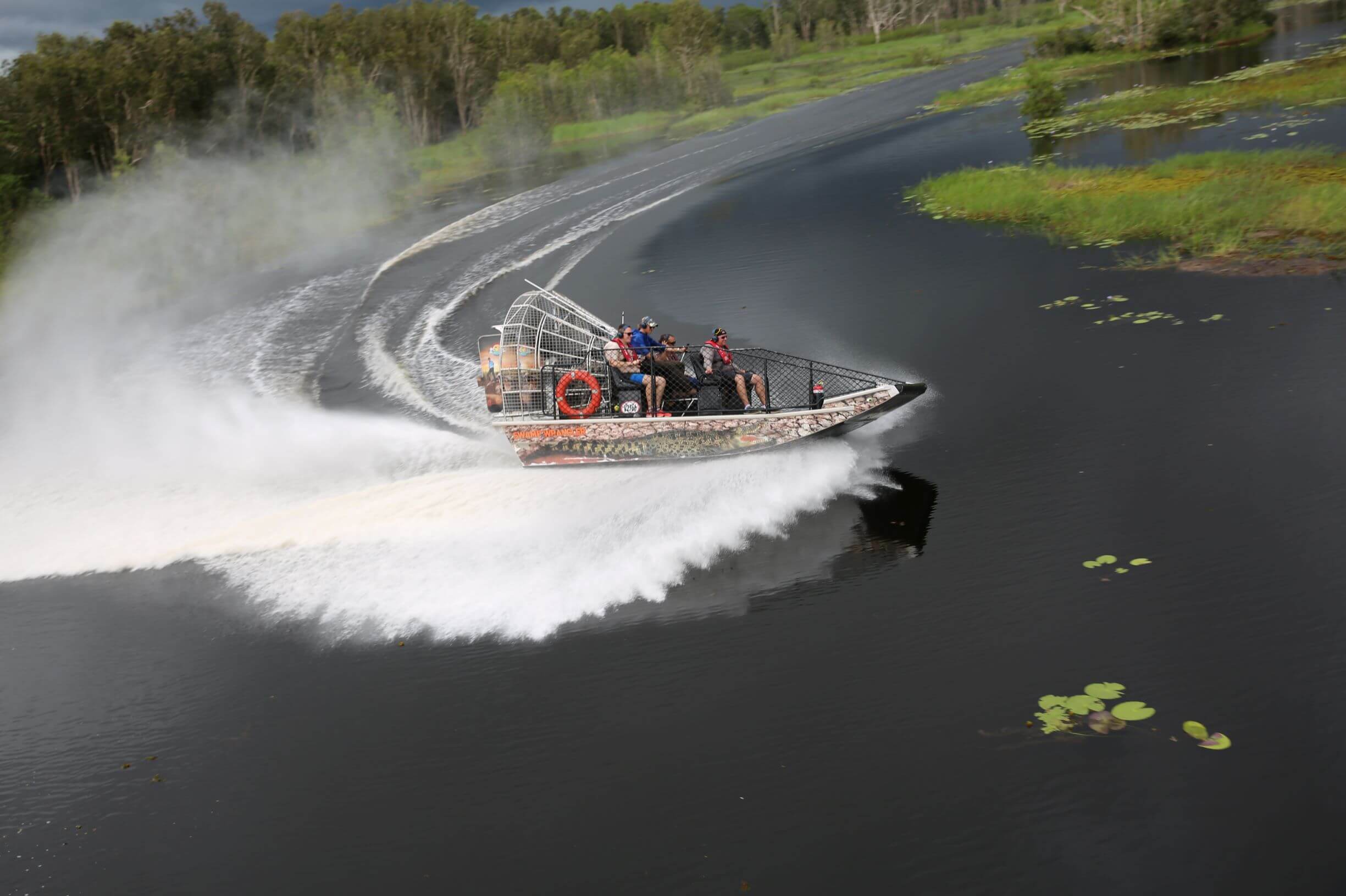 Image of Airboat On Body Of Water.